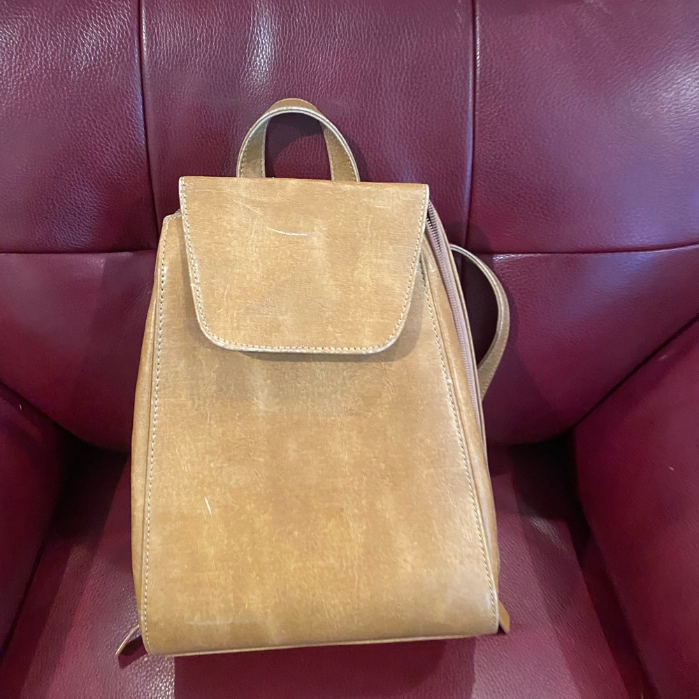 No brand name but cute barely used backpack style purse